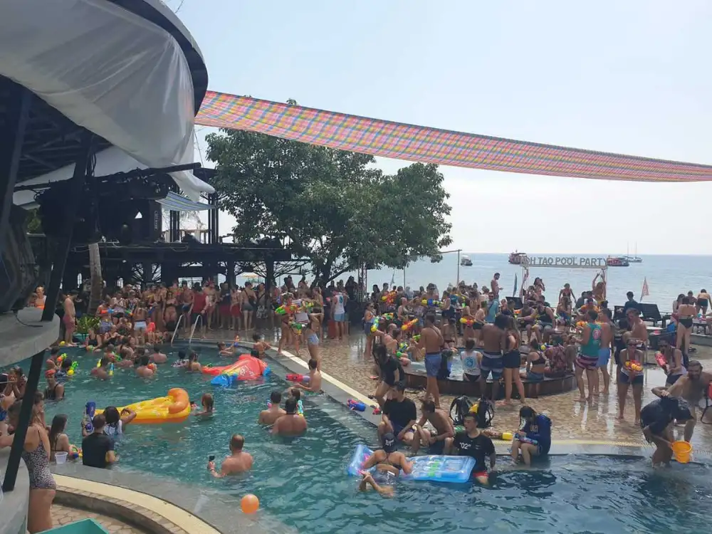 AC Bar on Sairee Beach, Koh Tao — pool party crowd and DJ at night