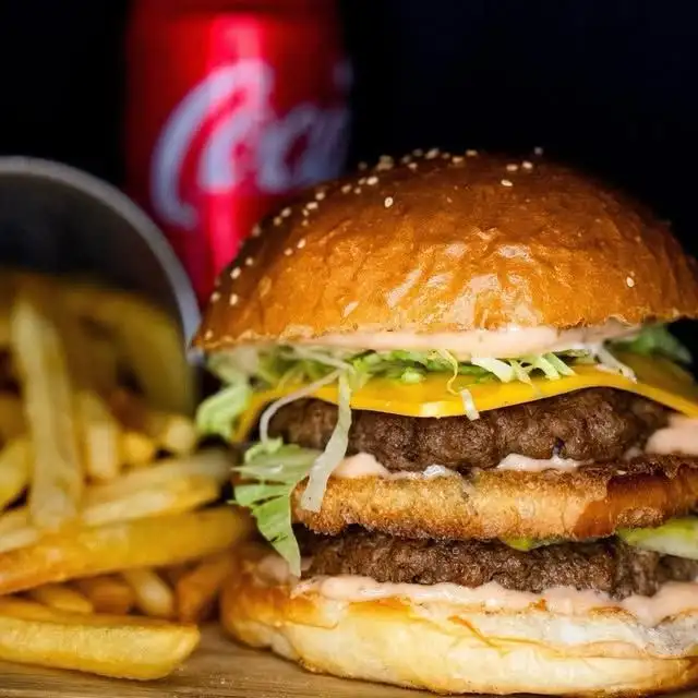 A beef burger with cheese and toppings from Juicy Burger, Koh Tao