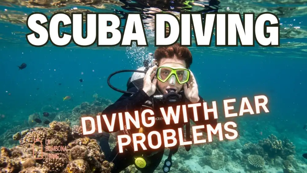 A scuba diver pinching their nose to equalise their ears while descending in clear blue water