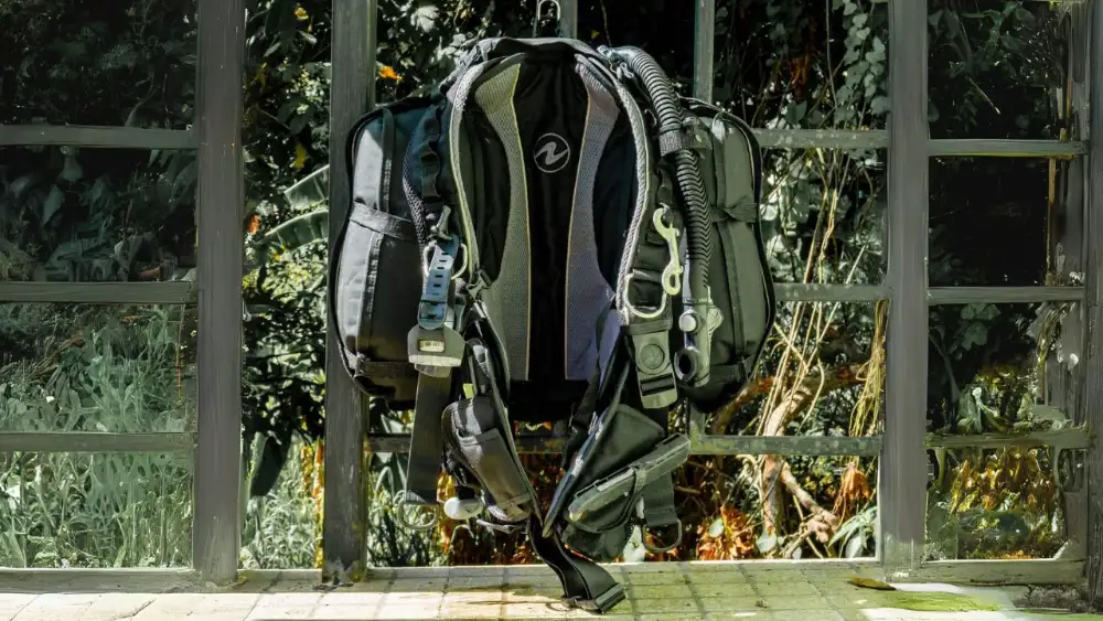 A complete scuba diving gear setup — BCD, regulator, mask, fins and tank ready for a dive