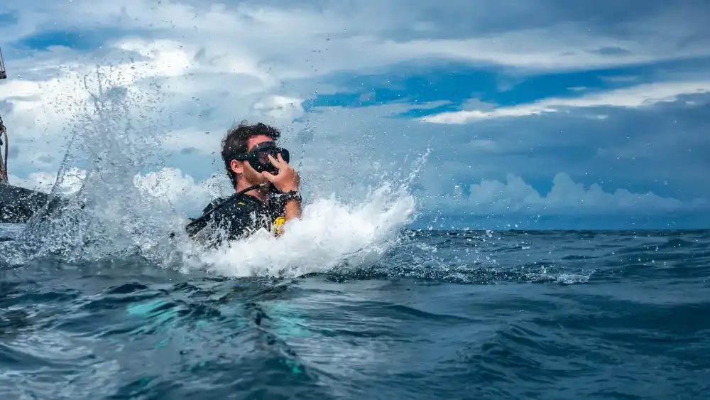A certified diver exploring a coral dive site in Koh Tao, Thailand