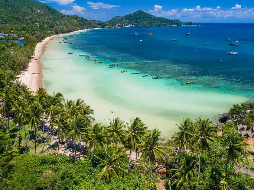 Aerial view of Koh Tao's coastline, beaches and green hills