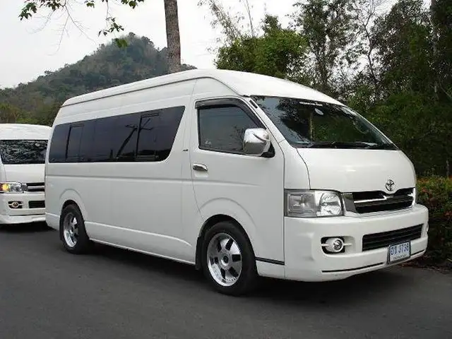 A shared tourist minivan parked on Koh Samui, the usual transfer from the airport to the ferry pier