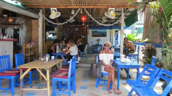 Pork pad kra pao with a fried egg and rice at Blue Chair, a roadside Thai eatery in Sairee, Koh Tao