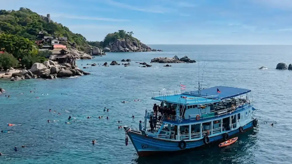 A fishing boat heading out from Mae Haad pier for a day of fishing around Koh Tao